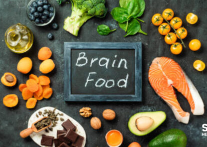 Healthy brain foods like salmon, chocolate and avocado on a table