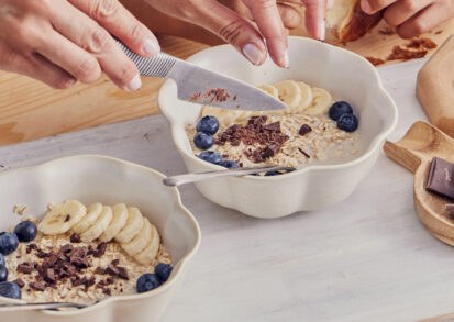Bowl of top foods for gut health - oatmeal, yoghurt and berries
