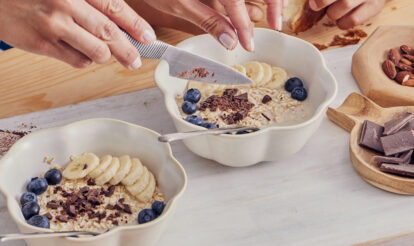 Bowl of top foods for gut health - oatmeal, yoghurt and berries